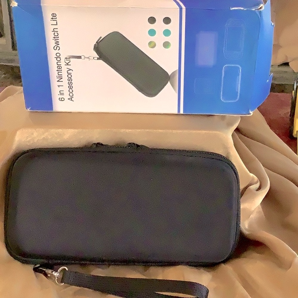 6 in 1 Nintendo switch lite accessory kit. Turquoise color silicone case